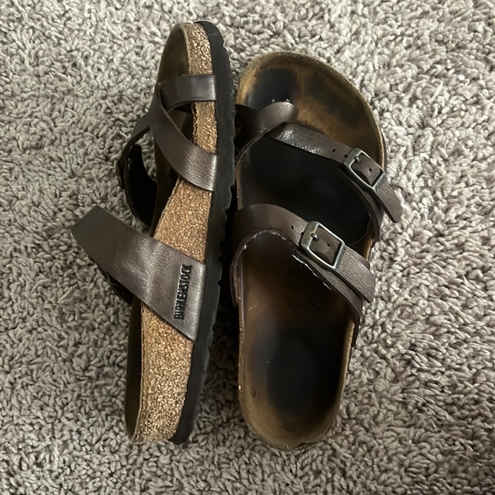 Brown chrome Birkenstocks with toe strap